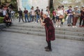 A 70-year-old grandmother sang Teresa TangÃ¢â¬â¢s song at Xuanwumen Square to attract a large number of people to watch